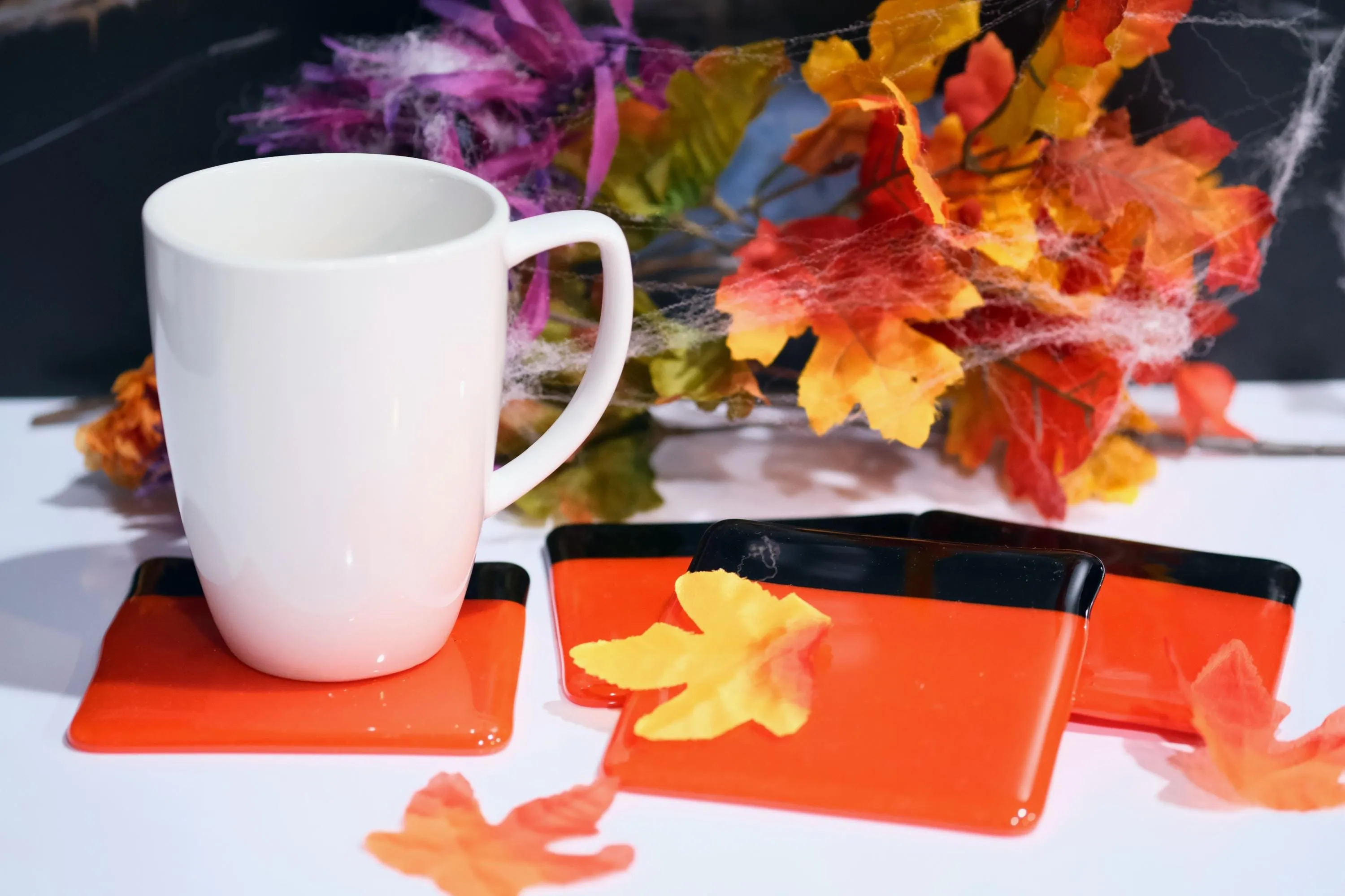 Vibrant reddish orange with black boarder fused glass drink coaster, set of 4, handmade, housewarming gift, home décor, halloween